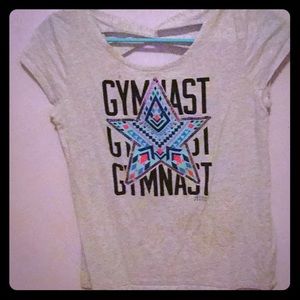 Justice gymnast shirt, with back detailing.